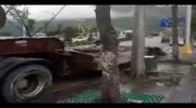 People trapped in car crushed by truck