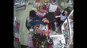 Robber hits cashier in a head with a bottle