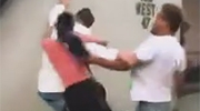 Girl tries to help her man being beating with a stick
