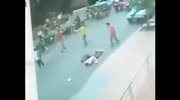 Knifed man drops like a stone.