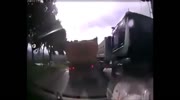 Car demolished between 2 trucks