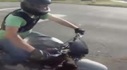 Biker`s girl flips in the air - her foot is nearly torn off