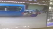 Man clamped against bus by unmanned truck