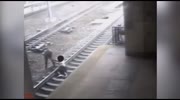 Officer pulls man away from train split second before impact.