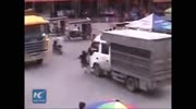 Woman killed after being bounced between 2 trucks while using her phone.