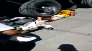 Rider is stuck under truck wheel