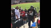 Football fans fight after Raider loss to Vikings.