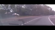 a police car becomes airborne and smashes into tree while chasing criminal