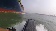 Bonehead jet skier nearly dies getting sucked under container ship