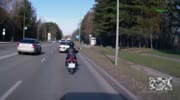 Biker plows into the back of a cop car