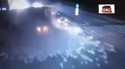 Truck crushes taxi cab at night.