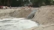3 people destrying a dam get washed away