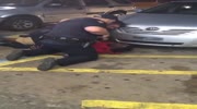 White cop murdering a black man.