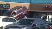 Guy Tries to Free SUV from Tow Truck