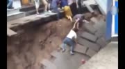 Huge Sinkhole suddenly opens up and swallow two people walking on sidewalk in China.