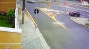 Speeding rider plows into the car and turns it over