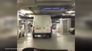 Driver bursts ceiling pipes in his tall white van.