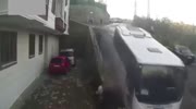 Bus slides on ice and heads straight to pedestrians.