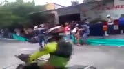 Speeding rider falls and his bike hits a girl