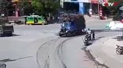 Truck overturns and crashes a man on the roadside