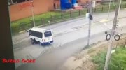 Biker rides under the wheels of a Bus