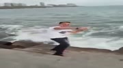 Posing guy falls into the sea