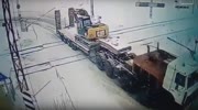 Freight Train Hits Truck Carrying Excavator