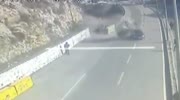 Van rolls of cliff and lands on a car