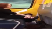 Woman eats dead skin off her feet in train