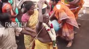 Worshippers practice devotion with extreme body piercings