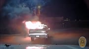 Cop pushes burning car to a further distance from restaurant with his cruiser