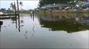 Pilot flies out of a racing boat