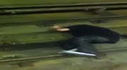 Guy knocked and falls on the rails