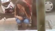 Scooter girl pisses on the street