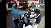 Cashier gets a gun on his head and stays cold as ice.