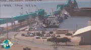 Huge cargo ship swallows smaller vessel