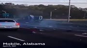 A driver in Alabama is seen standing up seconds after being ejected from an overturned Jeep