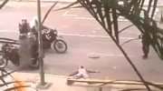 Man convulses while the Bolivarian National Guard assaults him