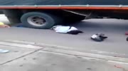 Motorbiker Still Alive Trapped Under The Wheels Of Truck.