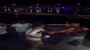 Man is thrown into the river while fight near latino club