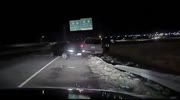 CAR STRIKES STRANDED VEHICLE THEN ROLLS, NARROWLY-MISSING OFFICER