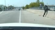OFFICER PULLS SUICIDAL MAN TO SAFETY FROM BRIDGE