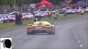 Race car drives over spectators