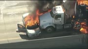 Auto compact and trailer collide and burn in fire