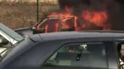 THE BURNING OF CAR NEAR A COMMERCIAL CENTER