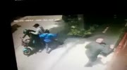 Men on motorcycle committing pedestrian theft