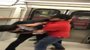 Dudes fight in a subway