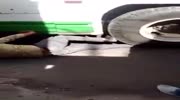 thief gets caught under wheels of bus