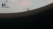 A Syrian helicopter bomb goes down very close to a rebel cameraman (Northern Hama, Syria)