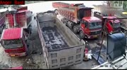 Driver Crushed Between Two Trucks.